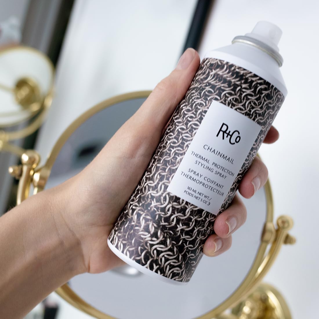 R+Co Chainmail spray mist illustrating flexible hold that brushes out easily