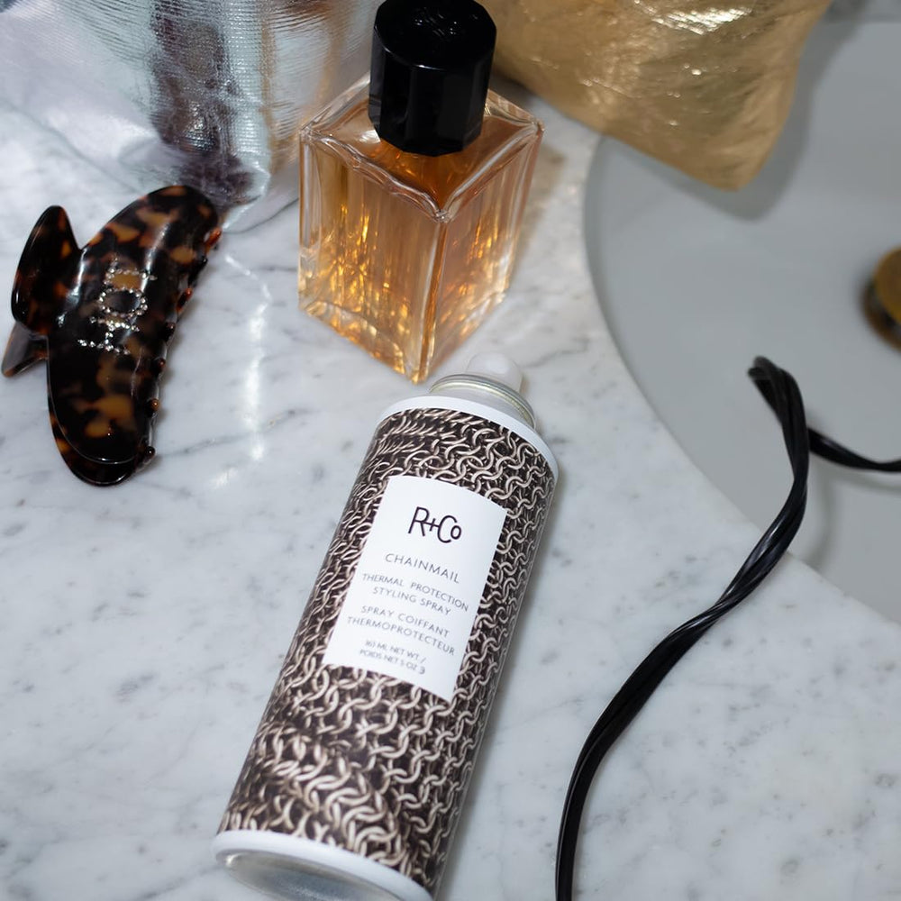 R+Co Chainmail bottle featuring Water Lily Extract for soft-touch volume