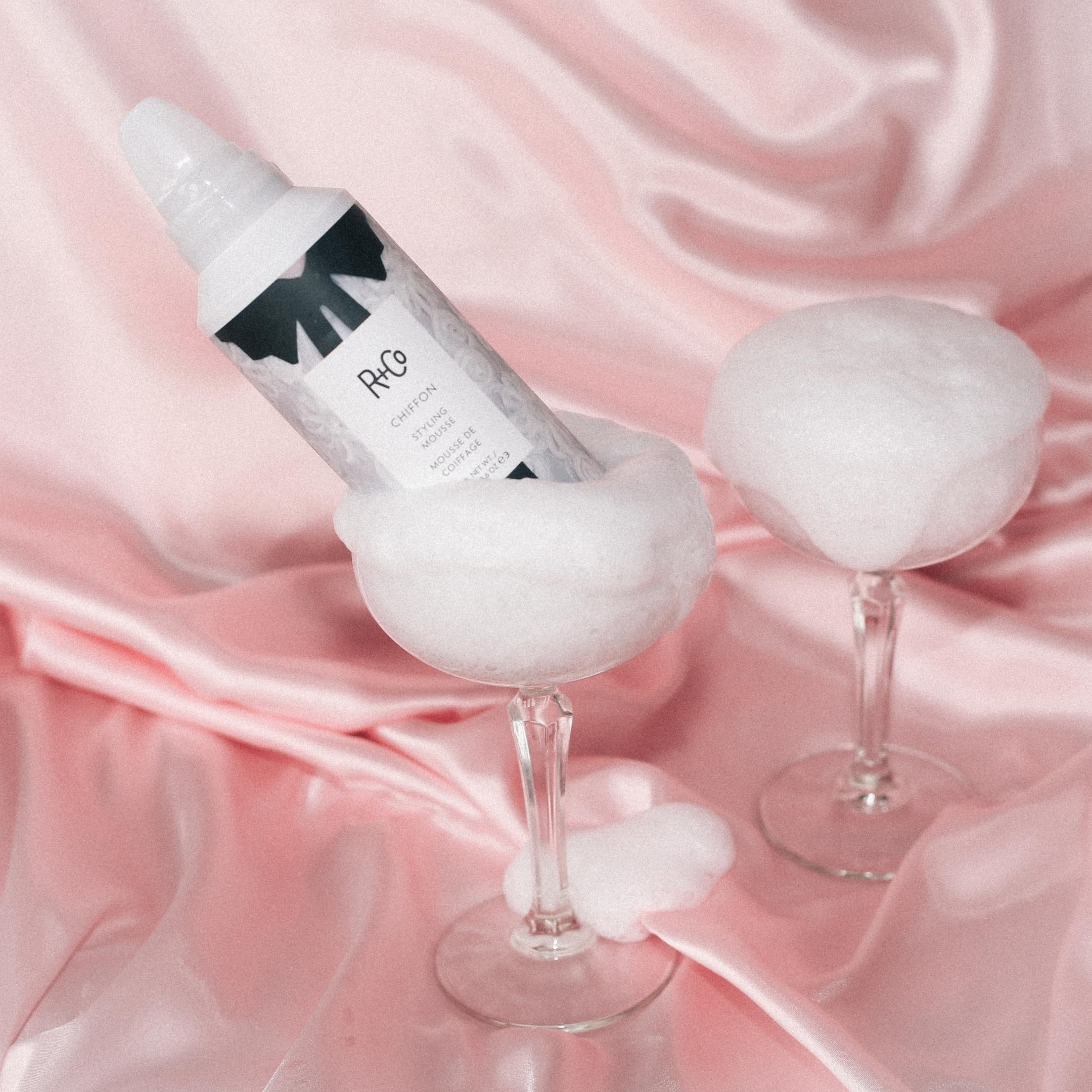 R+Co Chiffon Styling Mousse applying to hair to create lift