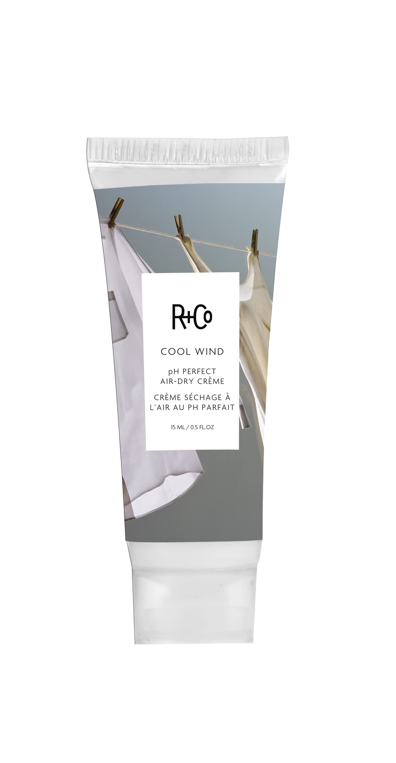 R+Co Cool Wind bottle pour demonstrates sleek frizz control and hydration for effortless air-dry styling.