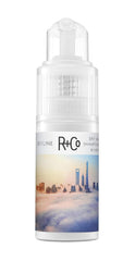 R+Co Skyline Dry Shampoo Powder applied at roots for oil absorption and lift.