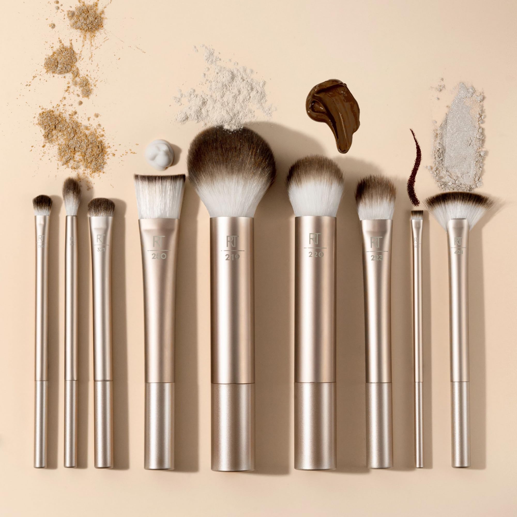Real Techniques Au Naturale Precision Fan Brush sweeps color onto cheeks.