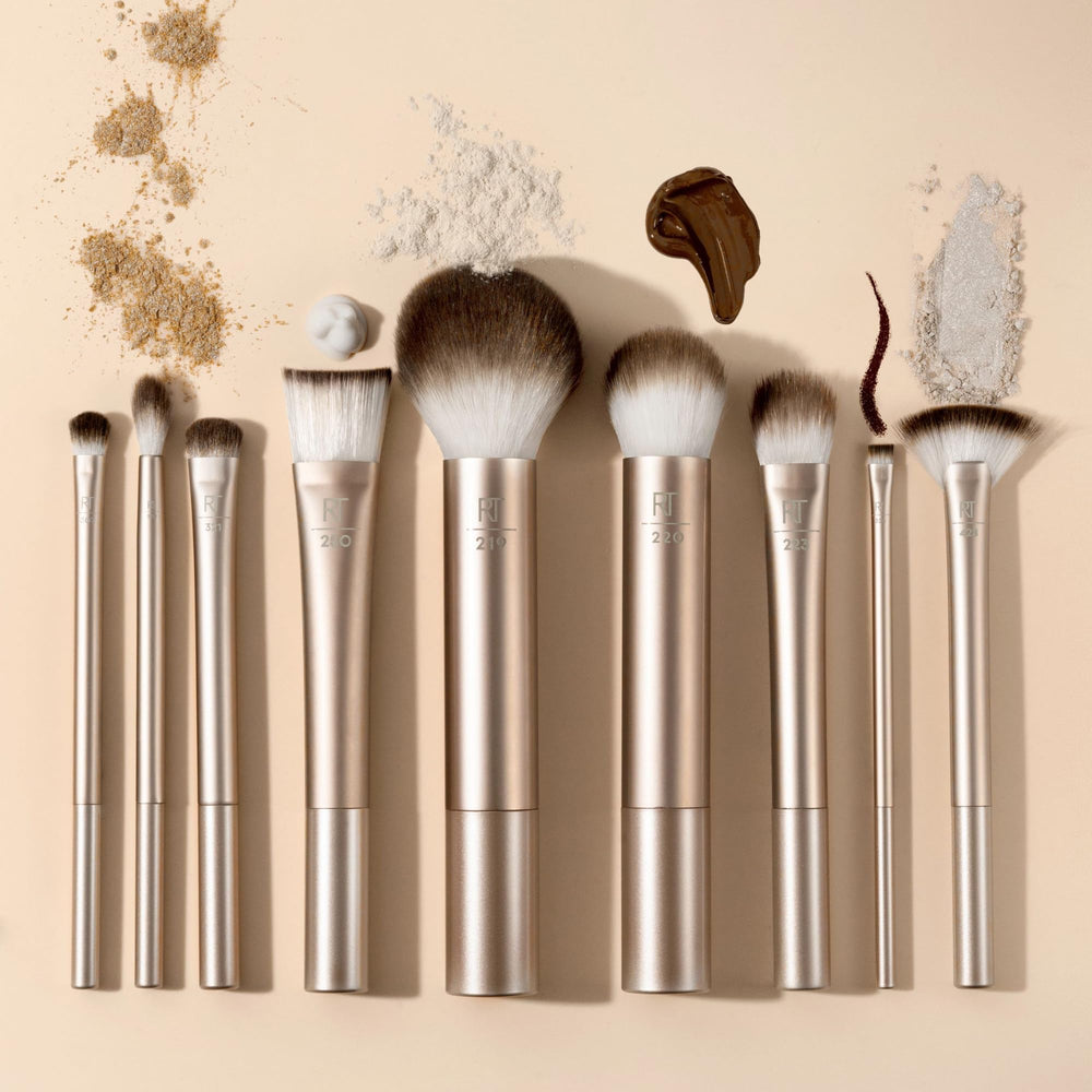 Real Techniques Au Naturale Precision Fan Brush sweeps color onto cheeks.