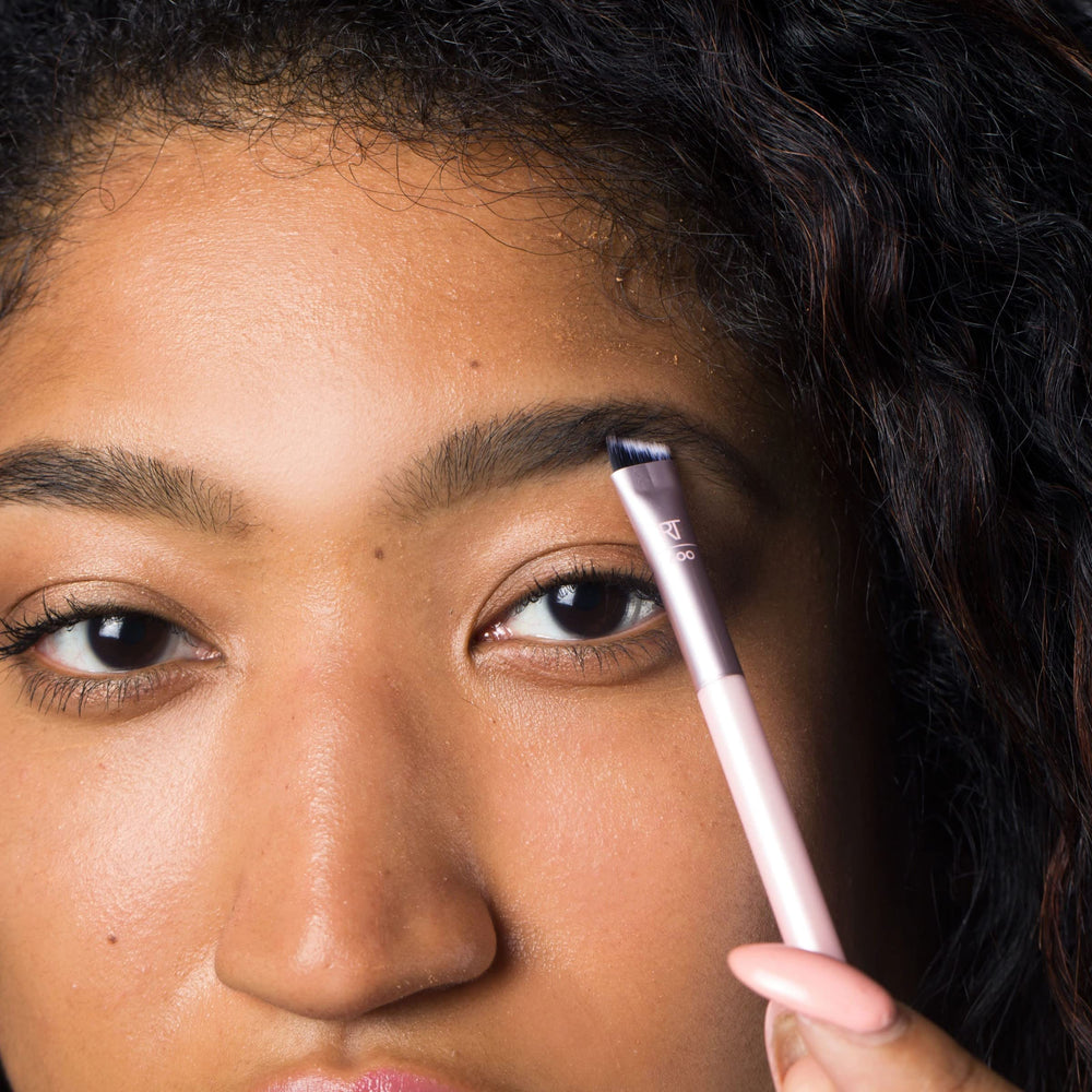 Real Techniques dual-ended brow brush applying product for even fill