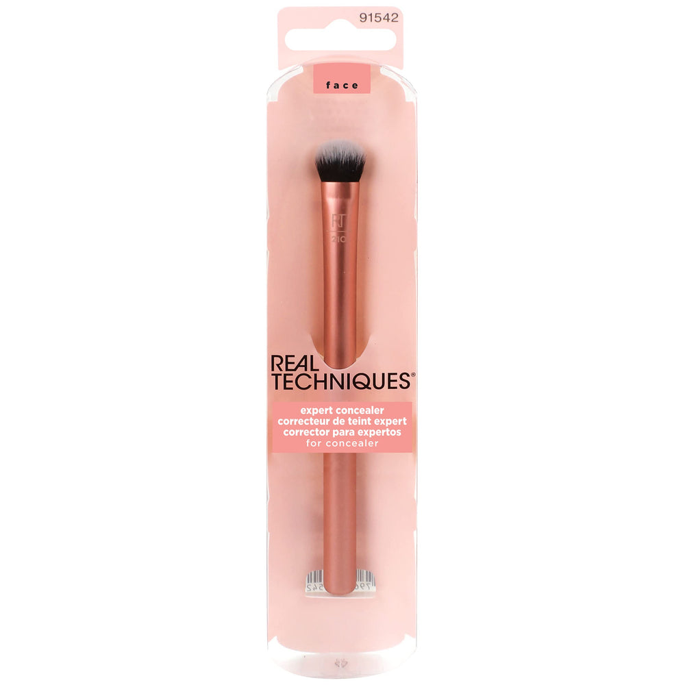 Real Techniques Expert Concealer Brush targets the eye area for smooth blending.