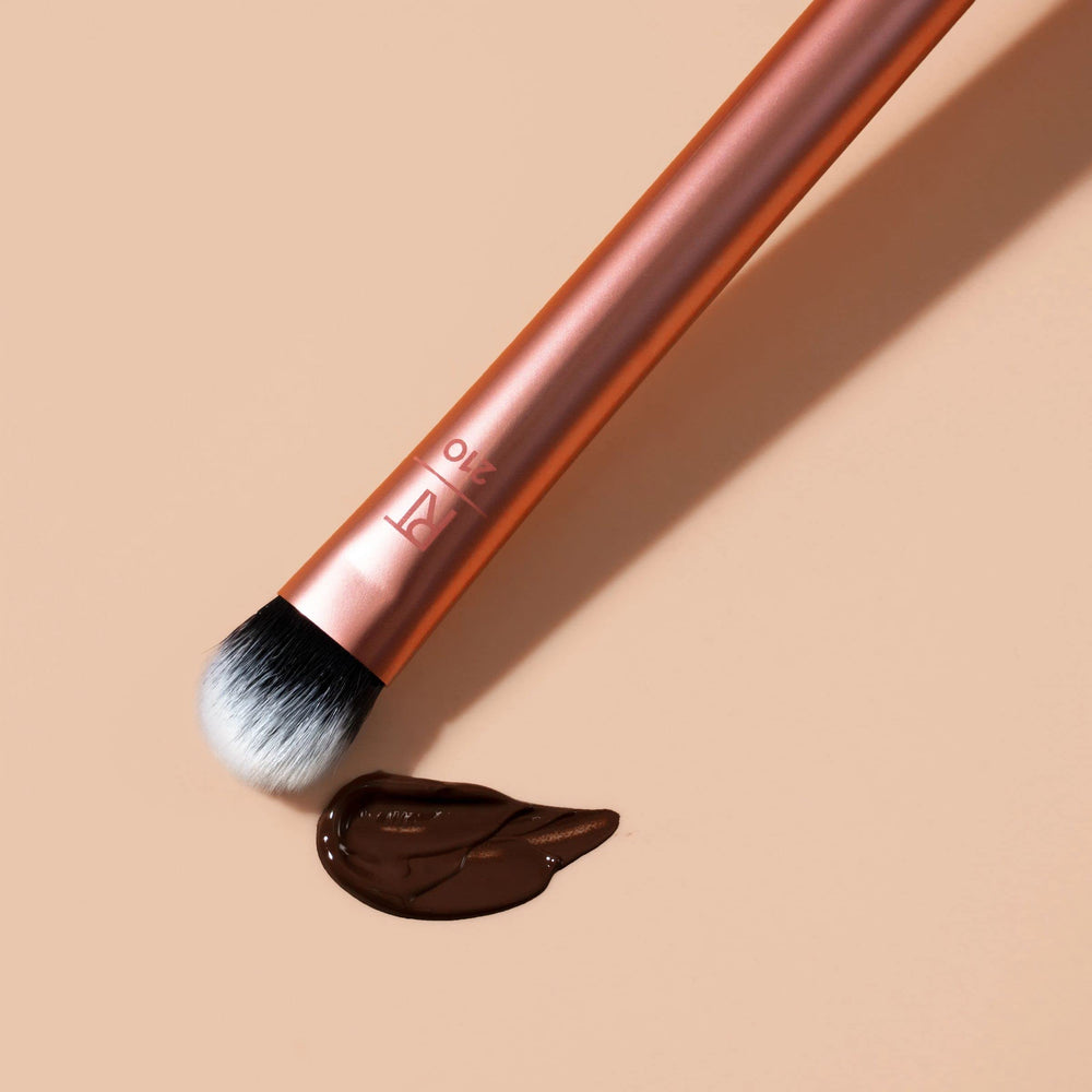 Real Techniques Expert Concealer Brush designed for flawless coverage above and below the eye.