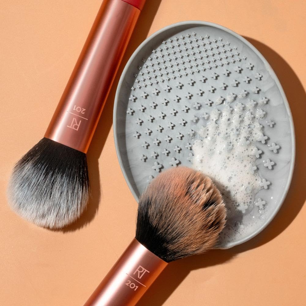 Lifestyle scene featuring Real Techniques cleansing palette on a vanity