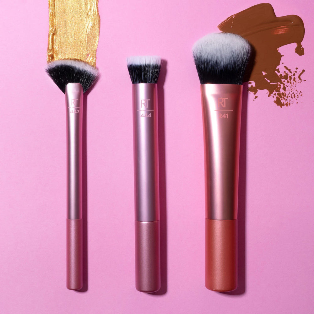 Real Techniques Seamless Complexion Brush in hand for quick touch-ups during daily routine