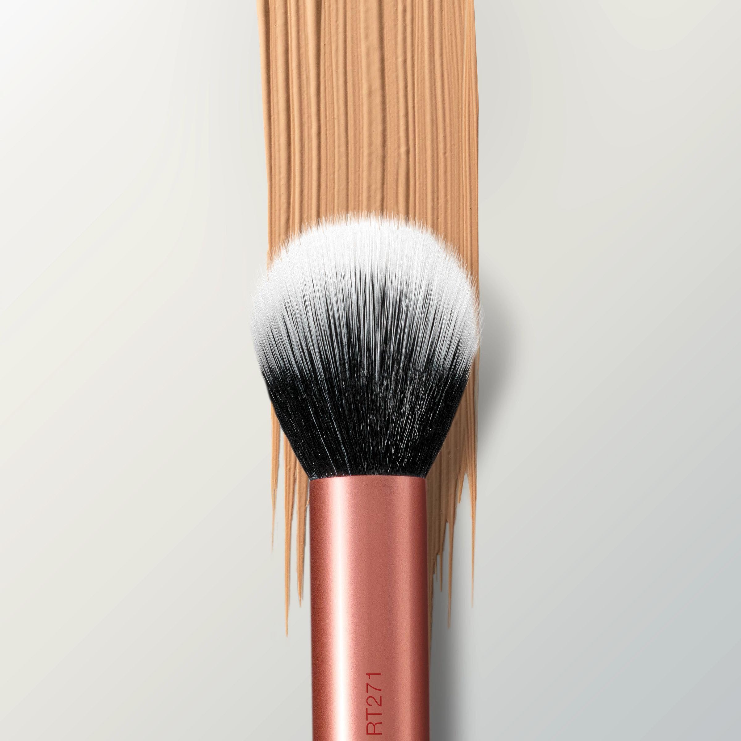 Soft bristle contact with skin using Real Techniques brush