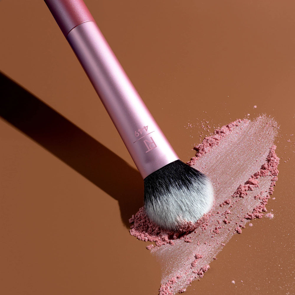 Real Techniques Tapered Cheek Brush RT 449 powder blush application for natural flush.