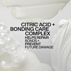Redken Acidic Bonding Concentrate bottle label close-up with color fade protection claim.