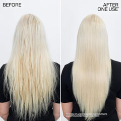 Dispensing Redken conditioner demonstrates easy application and bond strengthening
