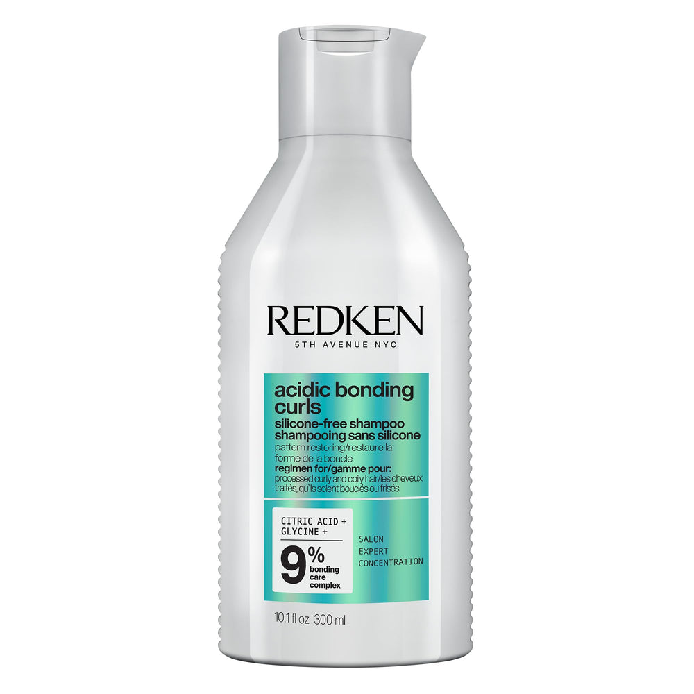Redken Acidic Bonding Curls Shampoo bottle highlighting silicone-free hydration for curls