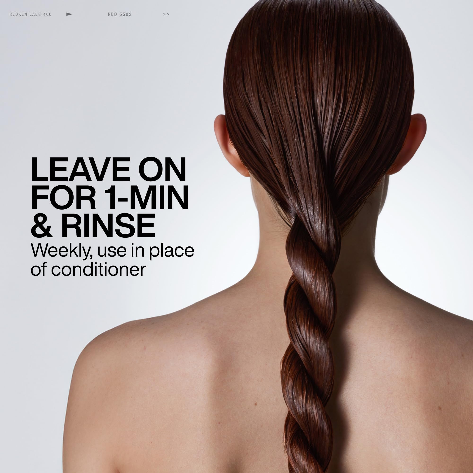 Redken Acidic Color Gloss bottle with hair showing smooth shine.