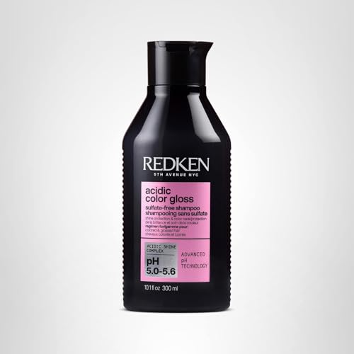 Shampoo bottle beside water droplets promotes gentle cleansing and color care.