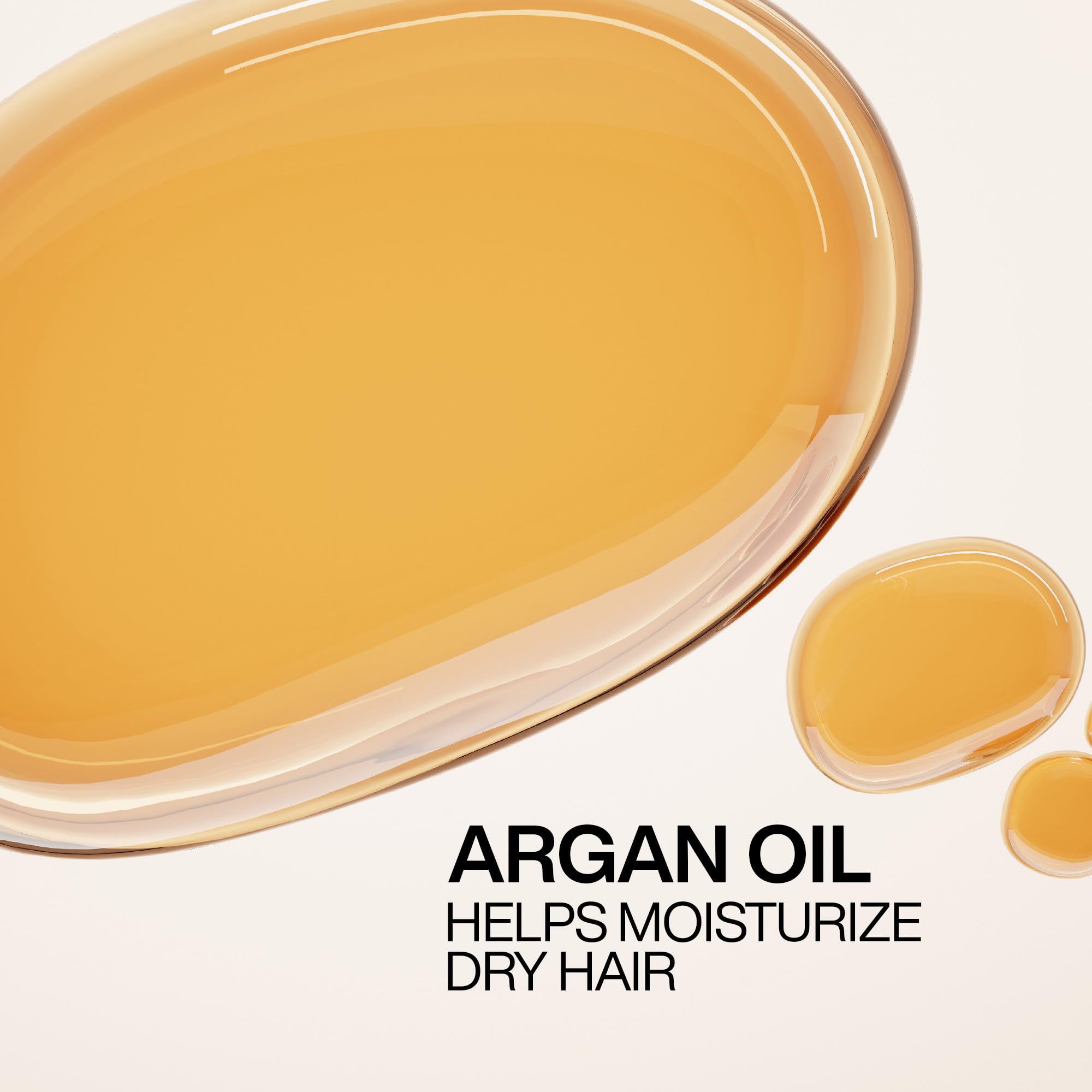Redken All Soft Argan-6 Oil on wet hair emphasizes smoothing and preparation for styling.