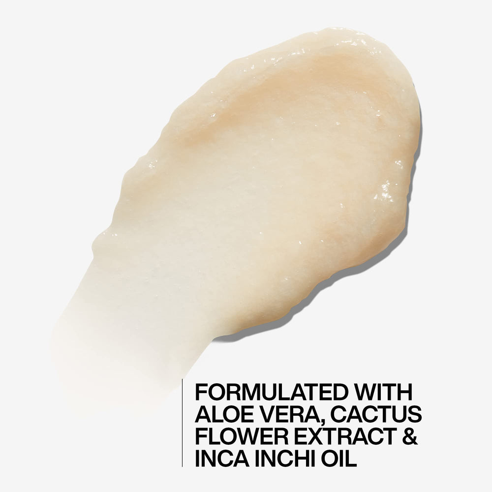 Redken All Soft Mega Curls conditioner applied to wet curls