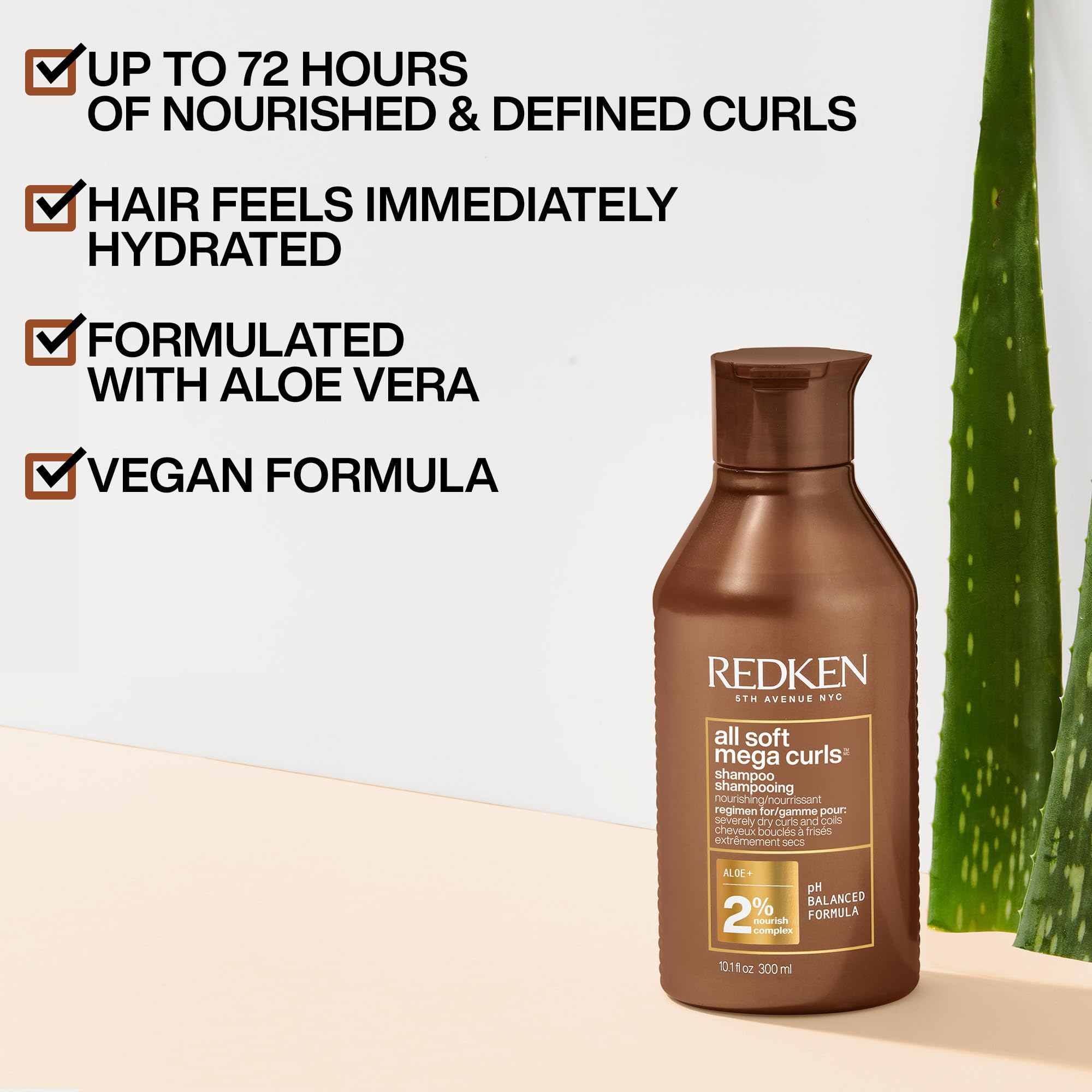 Redken All Soft Mega Curls Shampoo dispenser pump in action aiding easy application.