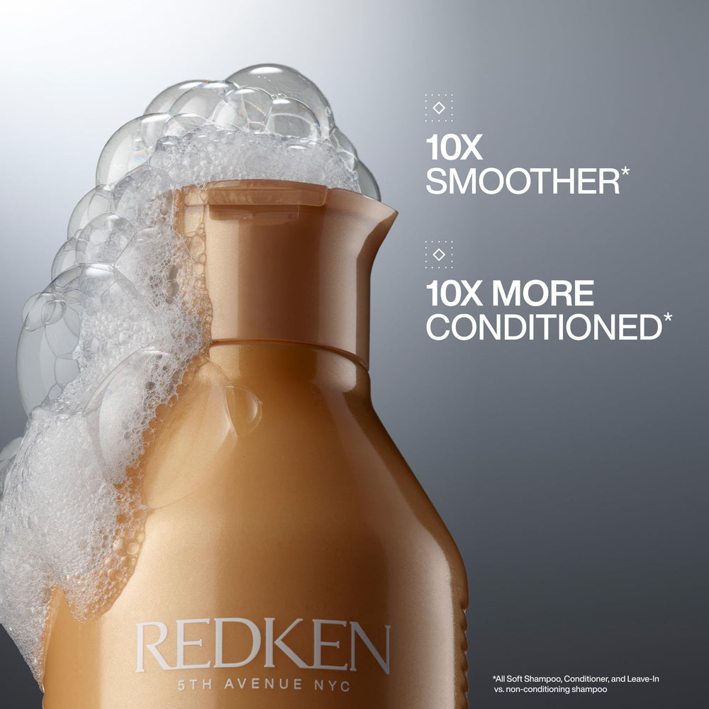 Close-up of creamy lather from Redken All Soft for smooth hair