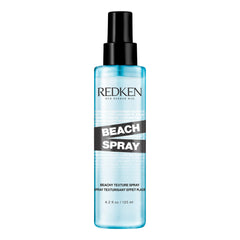 Redken Beach Spray bottle close-up showing sea-salt-free formula for texture.