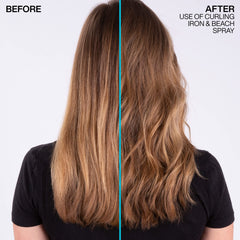 Hands applying Redken Beach Spray for texture and lift.
