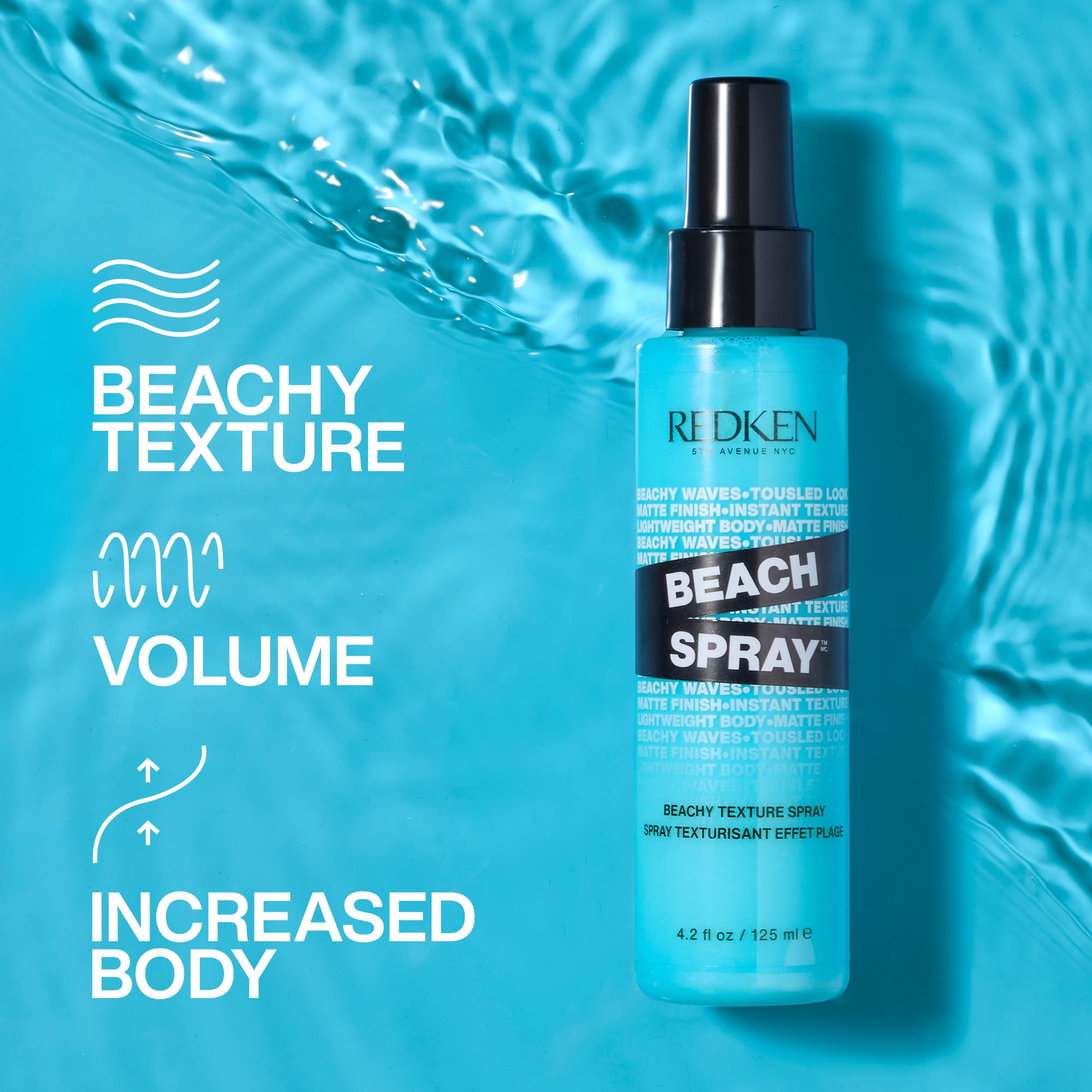 Redken Beach Spray mist being dispensed onto damp hair for volume.