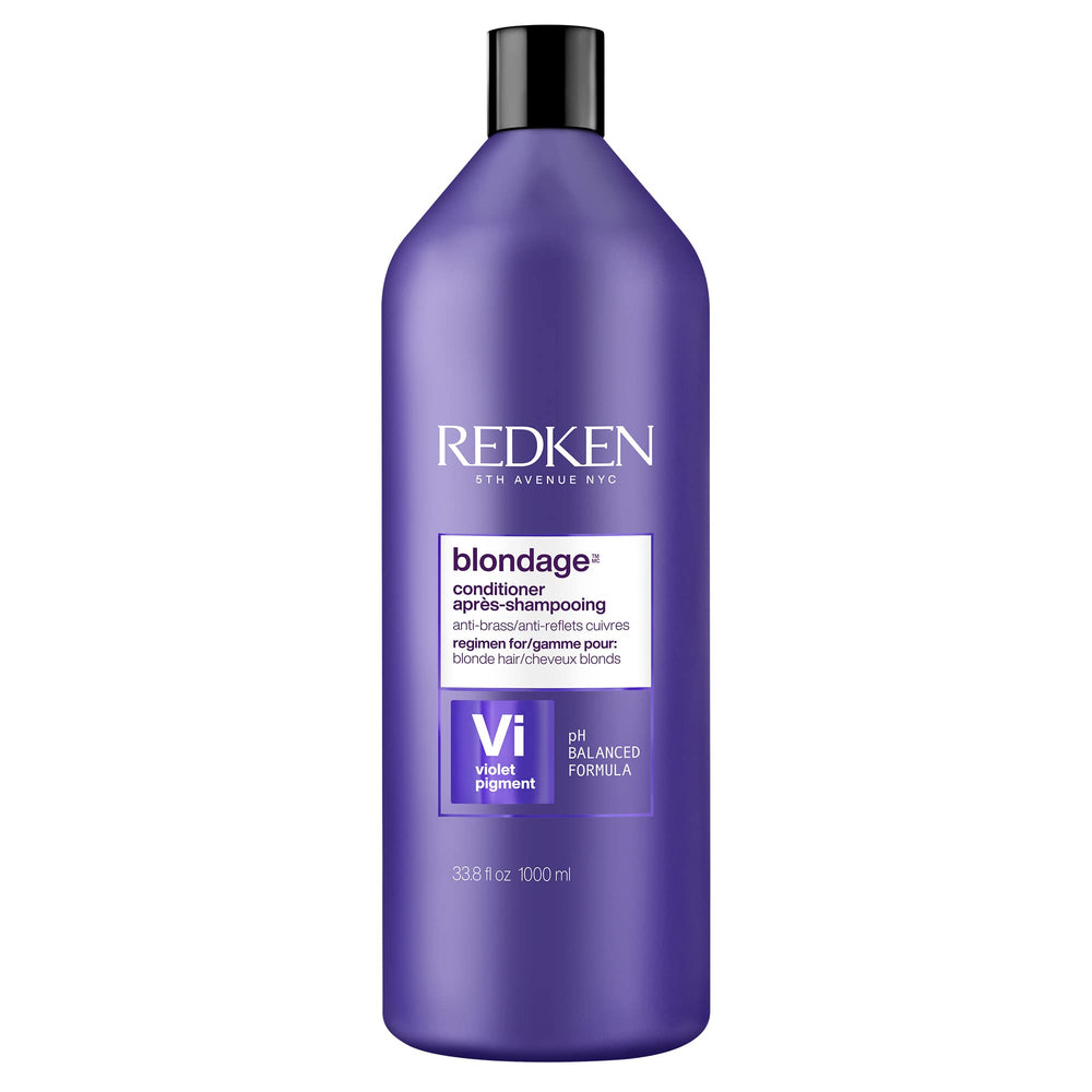 Redken Blondage bottle pour shows color-depositing action to neutralize brass.
