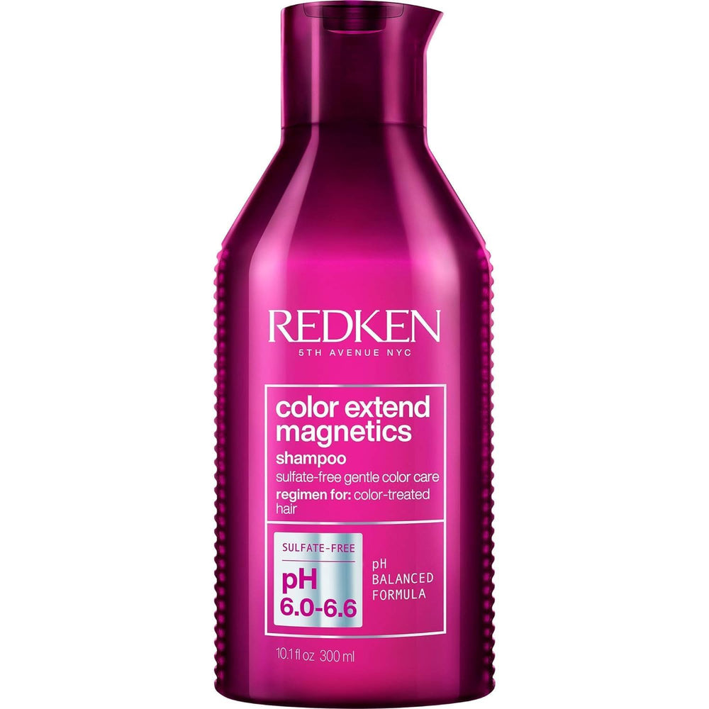 Redken Color Extend Magnetics shampoo bottle pouring to protect color vibrancy.