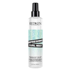 Redken Curl Refreshing Mist bottle shows on-the-go hydration and curl definition.