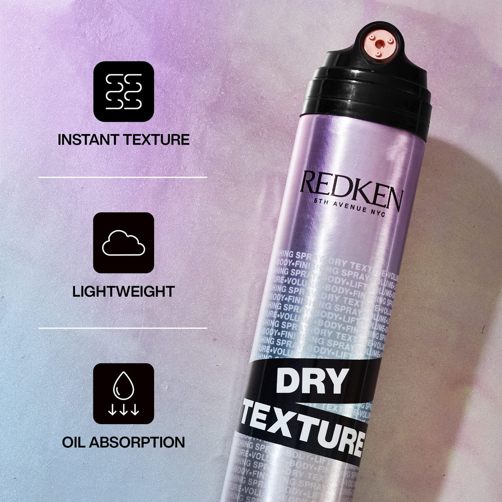 Hands applying Redken Dry Texture for beachy texture