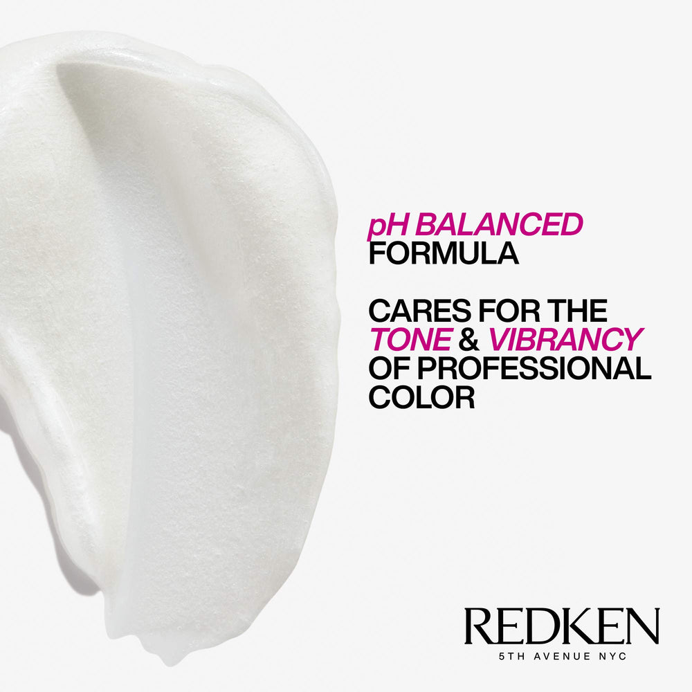Redken Extend Magnetics conditioner massaging into damp hair for conditioning.