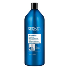 Redken Extreme Conditioner bottle on display for stronger, less breakage-prone hair.