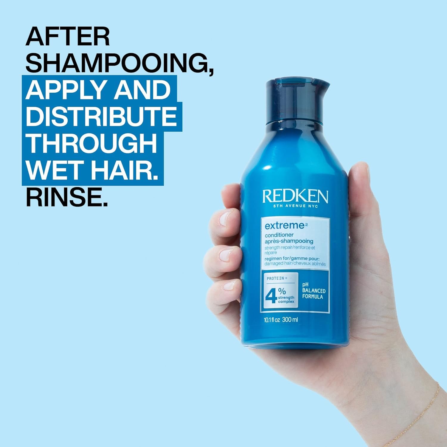 Redken Extreme Conditioner on a clean sink with shiny, frizz-free results.