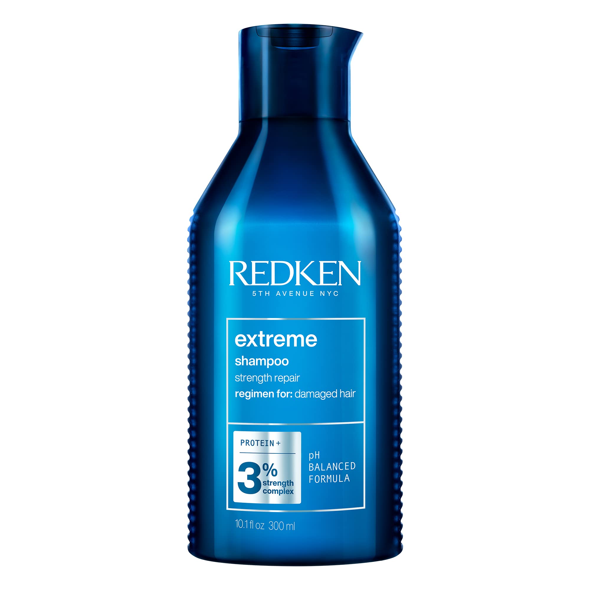 Redken Extreme Shampoo bottle pour showing strength for damaged hair