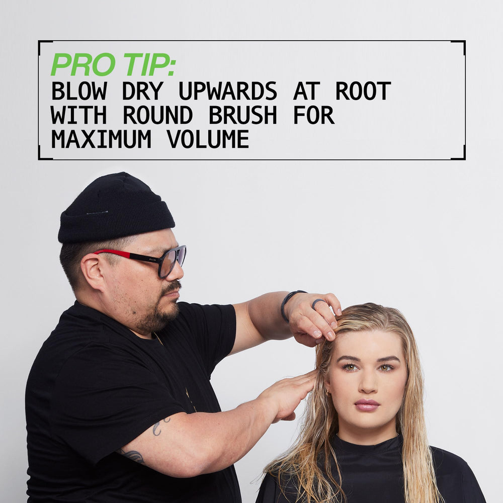 Redken Full Volume Mousse anti-frizz shield graphic implies humidity defense.