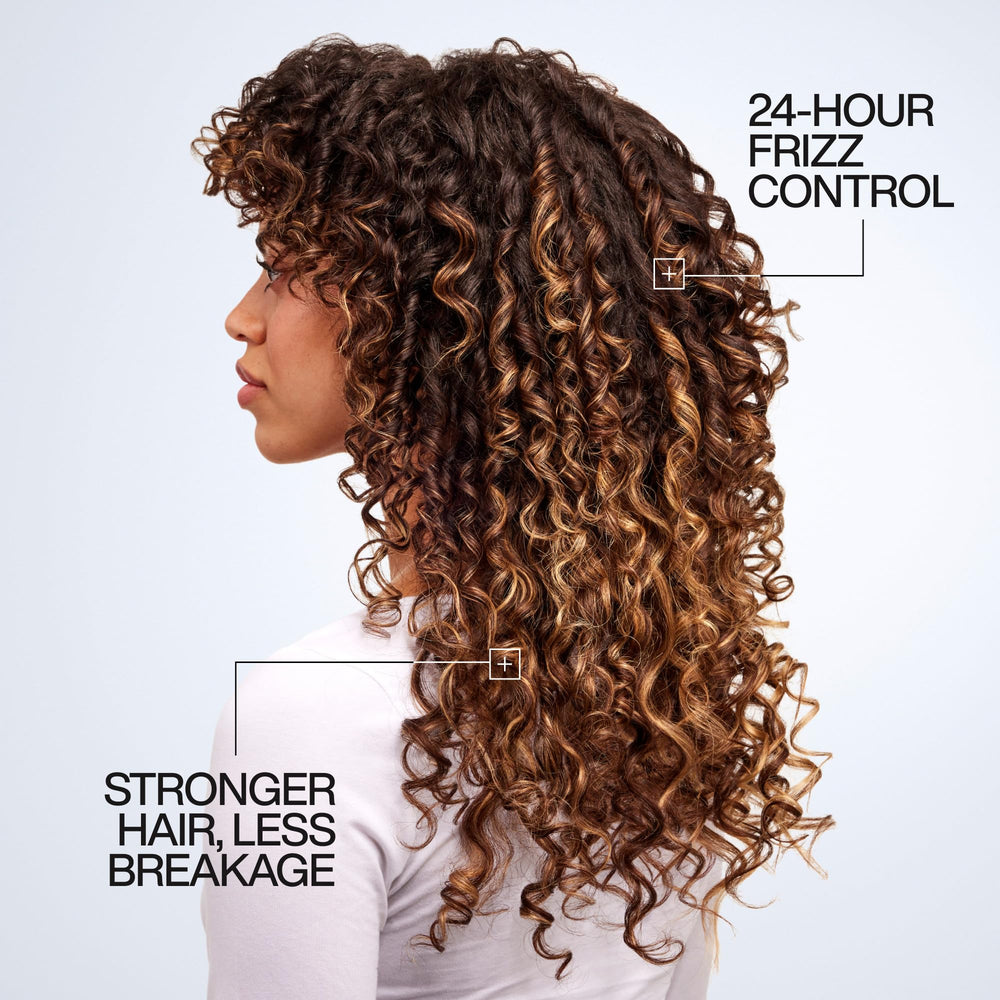 Redken One United being applied to damp hair for lightweight conditioning.