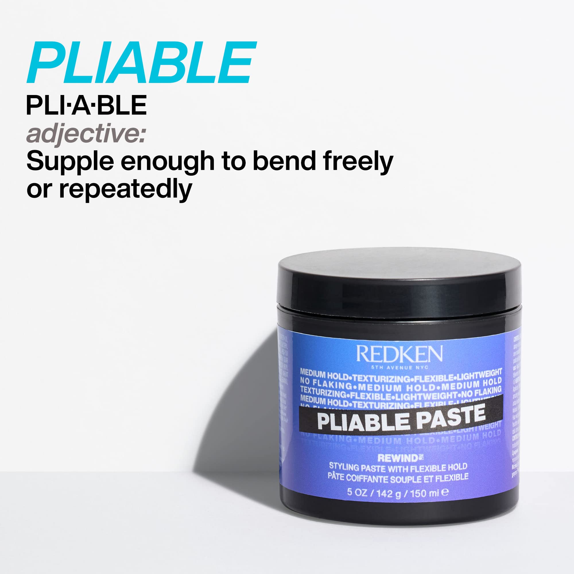 Long layered hair styled with Redken Pliable Paste for defined texture.
