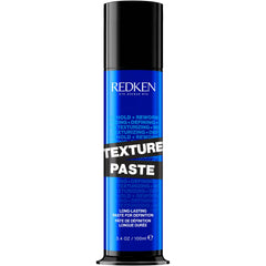 Redken Texture Paste long-lasting bottle pour showing texture and flexible hold.