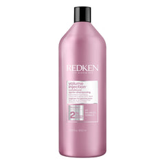 Redken Volume Injection Conditioner bottle pour demonstrates root lift potential