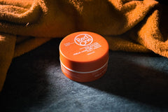 Redone Hair Wax Orange application on hands shows smooth glide.
