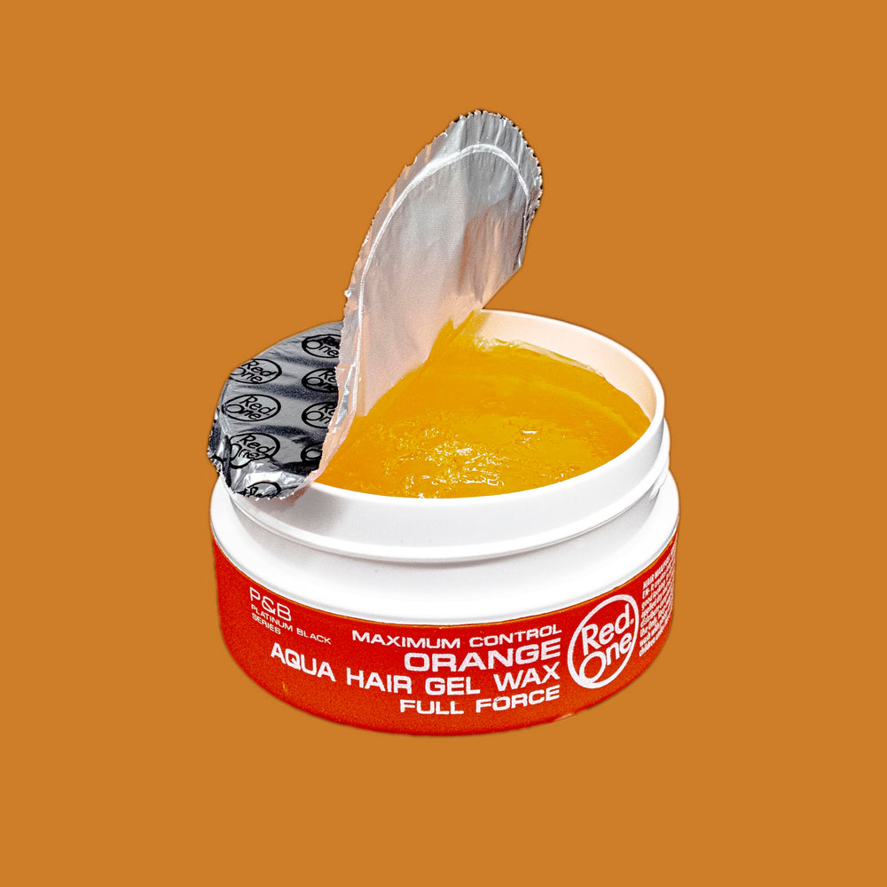 Redone Hair Wax Orange bottle label detail emphasizing high shine finish.