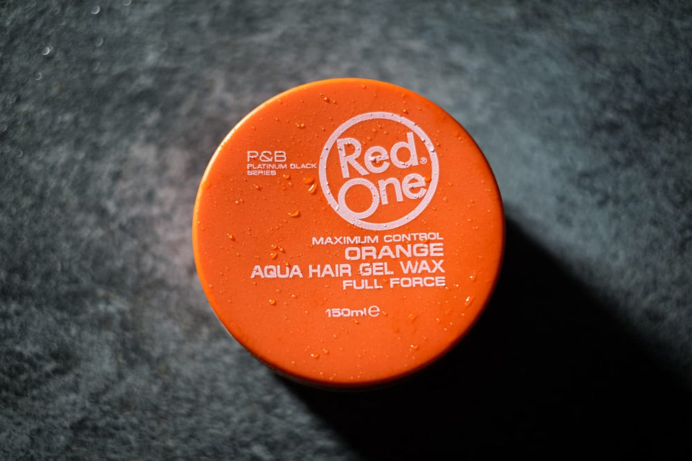 Redone Hair Wax Orange in a professional salon setting for lasting hold.