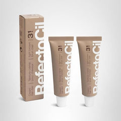 Close-up of RefectoCil cream hair dye 2-pack during mixing for a customized shade.