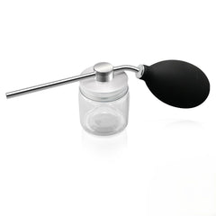 Refillable powder spray bottle close-up with precision nozzle for targeted application and reduced waste.