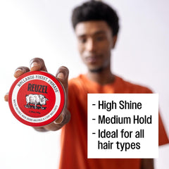 REUZEL Red Pomade hands applying demonstrates smooth, even distribution.