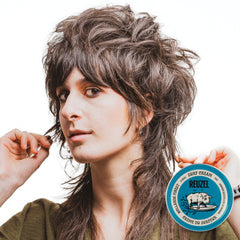 REUZEL Surf Texture Cream on hair with matte finish and lift.