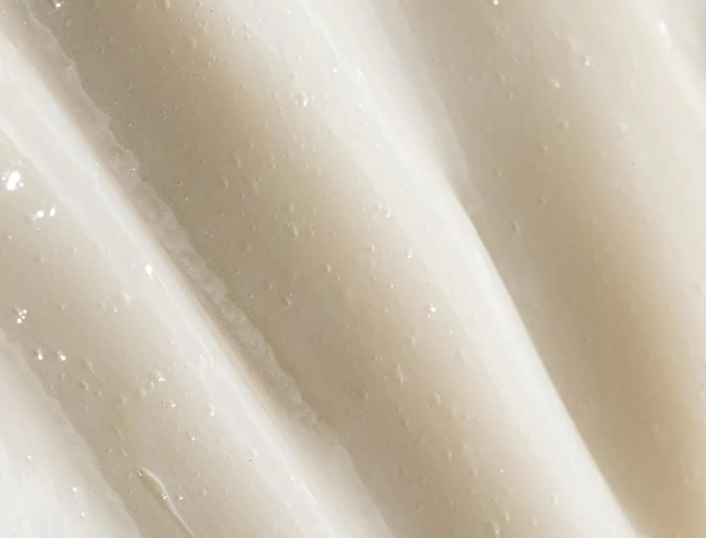 REVERIE leave-in texture close-up shows silky finish without weighing hair down