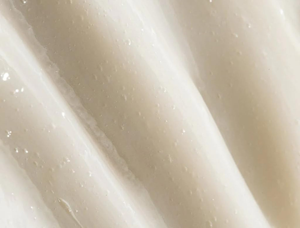 REVERIE leave-in texture close-up shows silky finish without weighing hair down