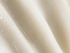 REVERIE leave-in texture close-up shows silky finish without weighing hair down