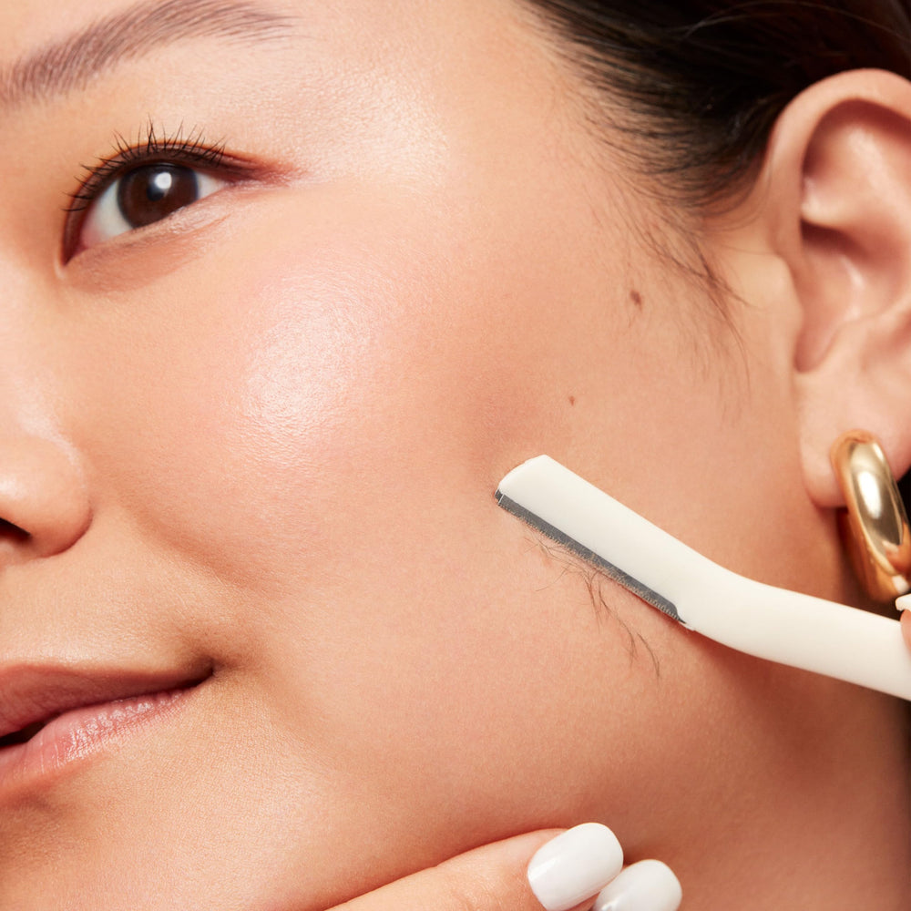 Revlon Face Defuzzer on peach fuzz for smoother makeup.